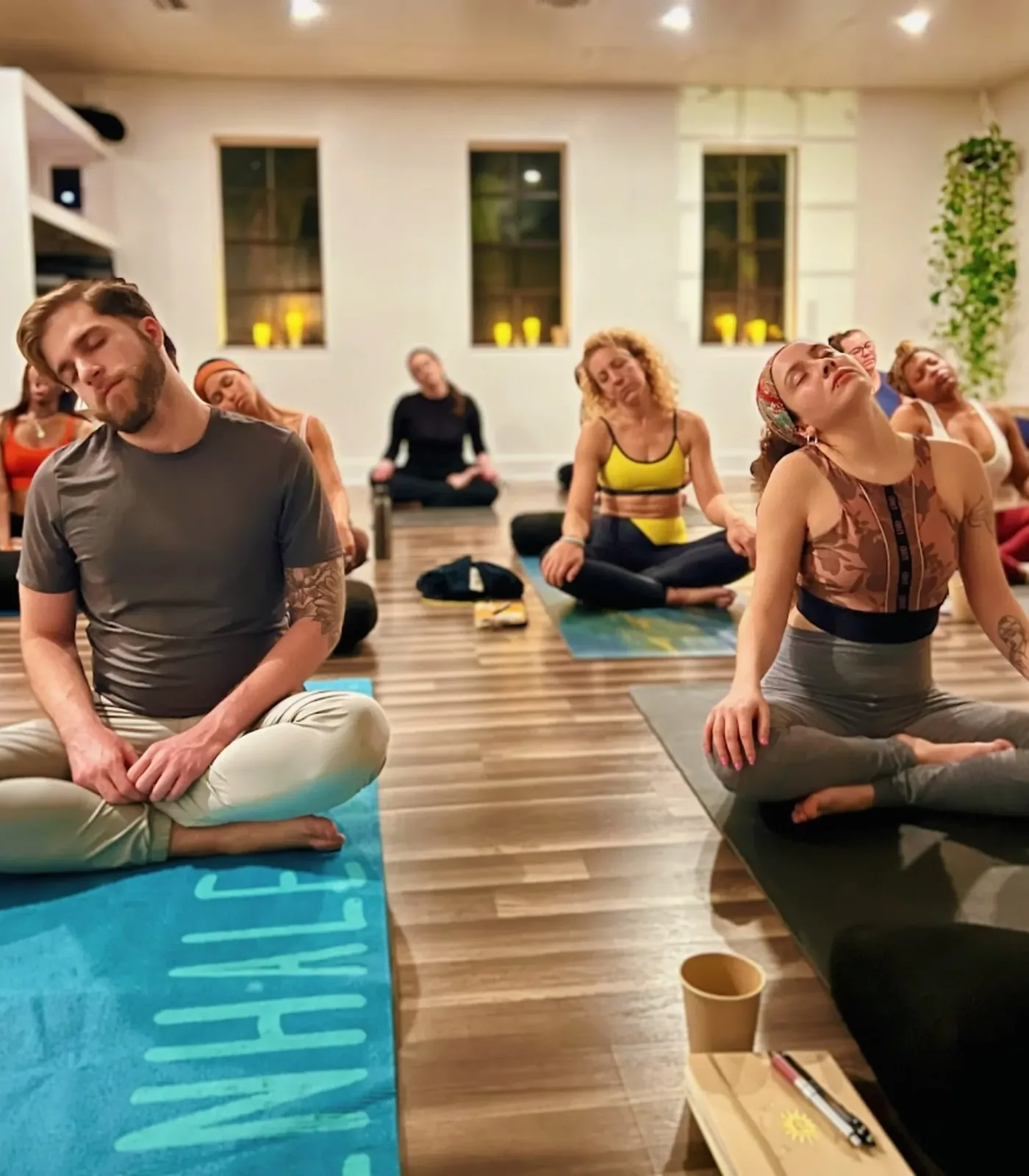 A candlelit meditation class at Kasa Yoga Studios in North Miami Beach